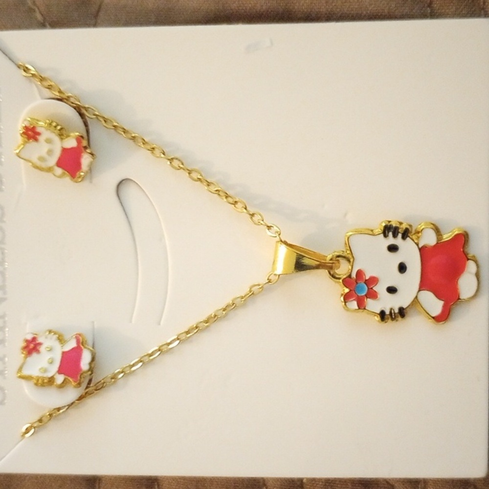 NWOT gold plated stainless steel jewelry set.